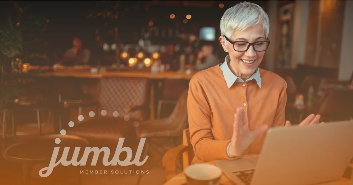 Older woman enjoying working on her laptop